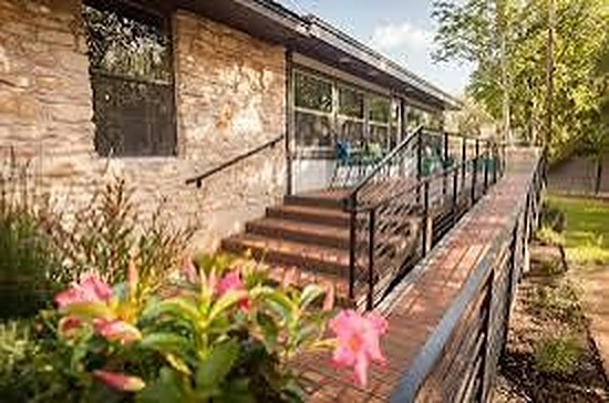 Accessible deck ramp lined with flowering plants