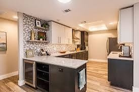 Kitchen with mosaic tile backsplash and quartz counters